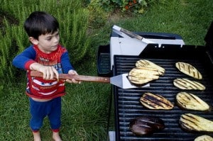 little boy grilling