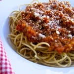Weight Watchers Friendly Slow cooker sausage spaghetti sauce white rimmed bowl red checked napkin