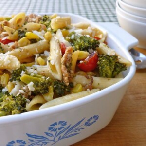 pasta with sausage and vegetables in blue flower corning casserole dish
