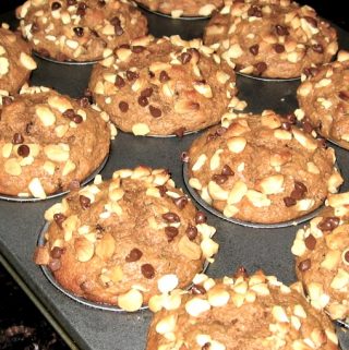 Pan of muffins with macadamia nuts and chocolate chips on top