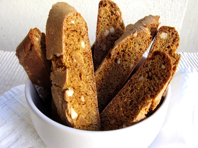 White bowl with gingerbread biscotti standing on end