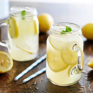 Fresh homemade lemonade in jar with ice and mint