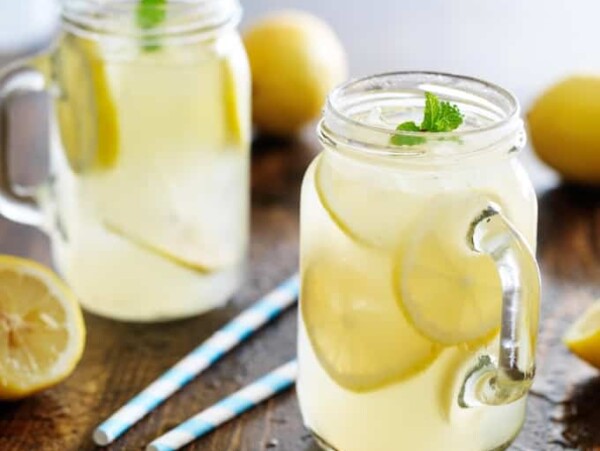 Fresh homemade lemonade in jar with ice and mint