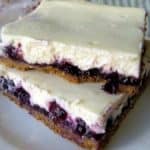 Blueberry Cheesecake Bars Stacked One On Top another