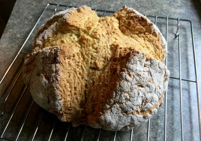 Simple White Irish Soda Bread Loaf on a cooling rack
