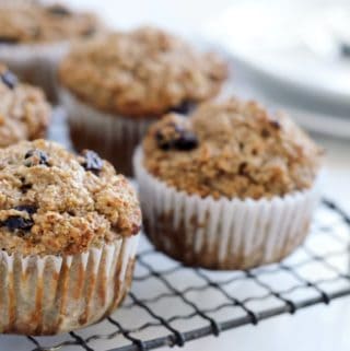 Healthy bran muffins with raisins on cooling rack