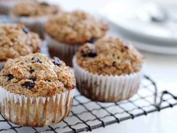 Healthy bran muffins with raisins on cooling rack