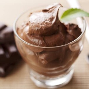 Close up of fresh chocolate mousse garnished with mint