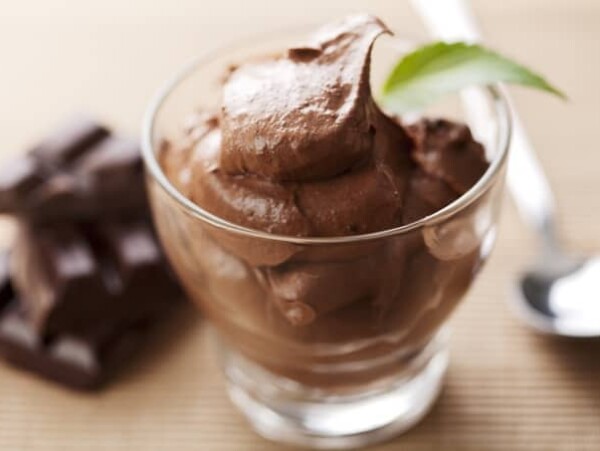 Close up of fresh chocolate mousse garnished with mint