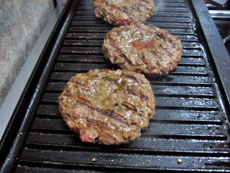 Homemade burgers on grill