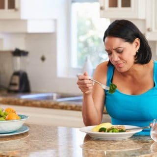Woman in Kitchen Fed Up with Diet