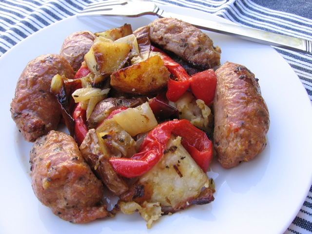 Oven-Roasted Sausage, Peppers, Onions and Potatoes on white dinner plate.