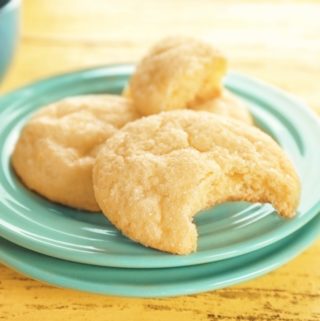 Tasty sugar cookies on a green plate