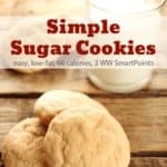 a small stack of sugar cookies on board with glass of milk in background with Text Box for Pinterest PIN