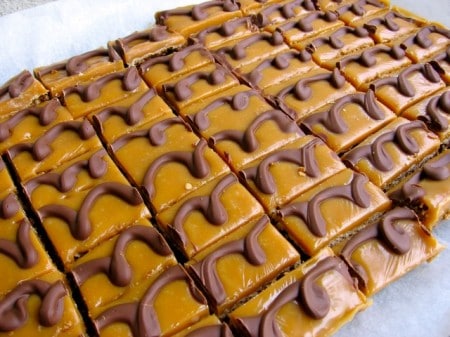 Caramel Chocolate Oatmeal Mini Bars on parchment paper.