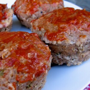 Mini Meat Loaf Muffins on a white plate with red checked napkin