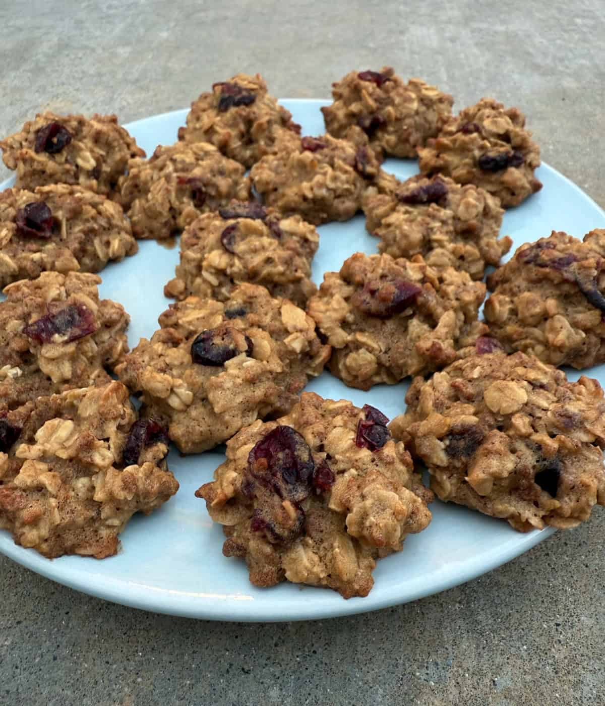 Grapenuts Breakfast Cookies with dried cranberries on round blue plate.