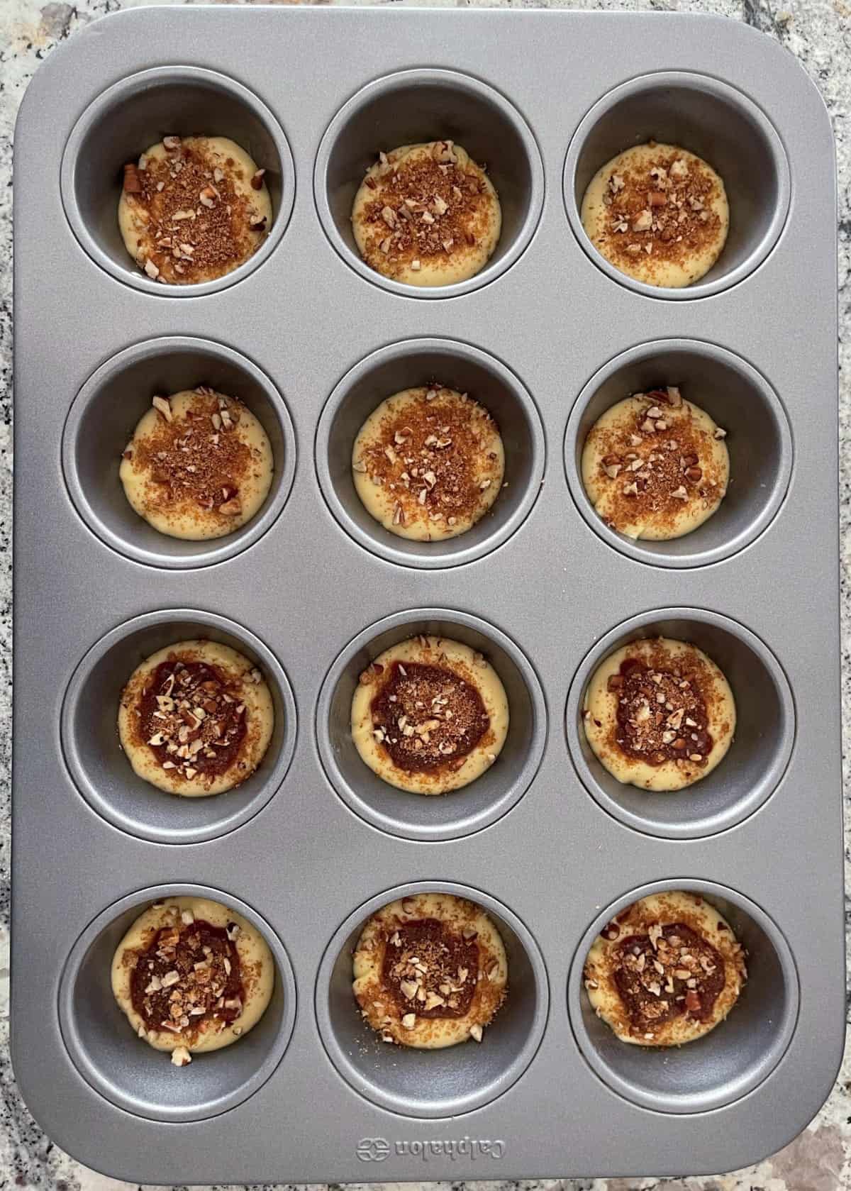 Making cinnamon streusel muffins in a standard muffin pan.