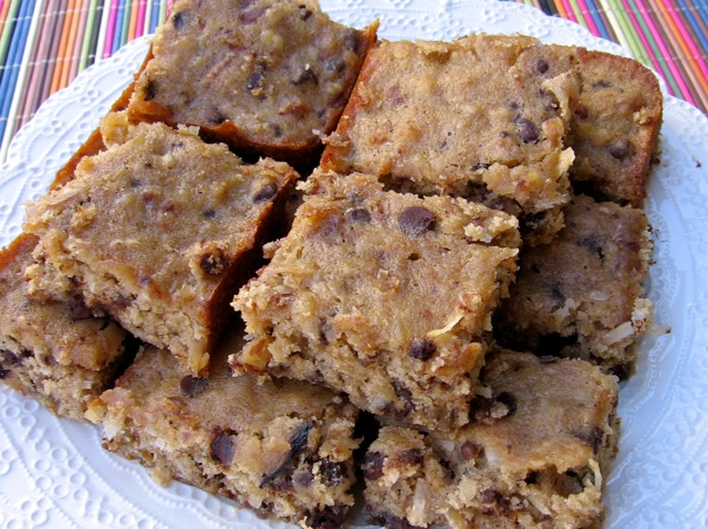 Low Fat Banana Chocolate Chip Cookie Bars stacked on a white serving plate.