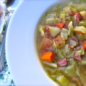 Skinny Leftover Corned Beef and Cabbage Soup in white wide rimmed soup plate