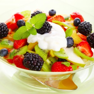 Fresh fruit salad with yogurt and mint