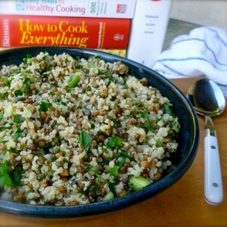 Light Healthy Lemon Lentil Quinoa Salad blue bowl cookbooks behind spoon alongside