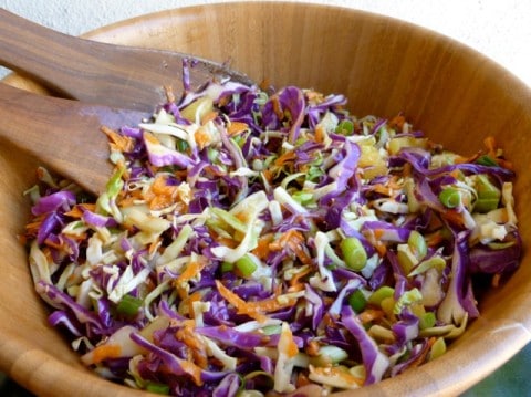 Low Fat Asian Slaw with Purple Cabbage and Pineapple in a wooden salad bowl
