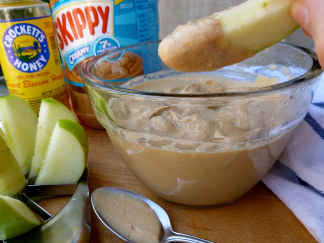 Skinny Creamy Peanut Butter Dip with fresh cut apple wedges.