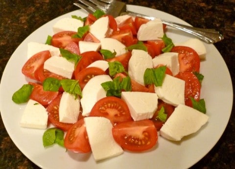 Tomatoes and Mozzarella Salad on serving platter.