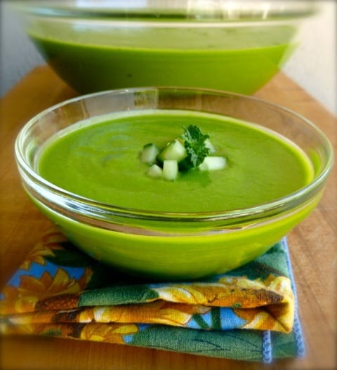 Chilled Asparagus Soup with Spinach and Avocado in small glass bowl.