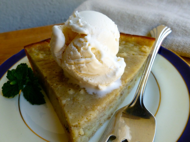 Banana Bread Pie A La Mode on a plate with a scoop of vanilla ice cream