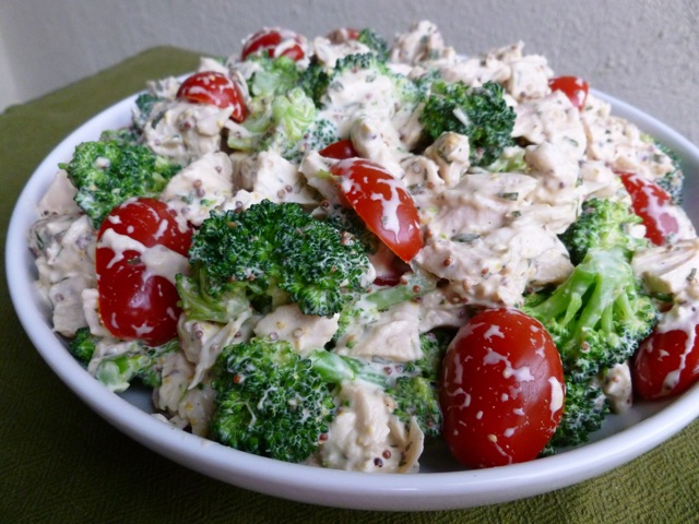 Mustard Chicken Salad with tomatoes and broccoli in white bowl.
