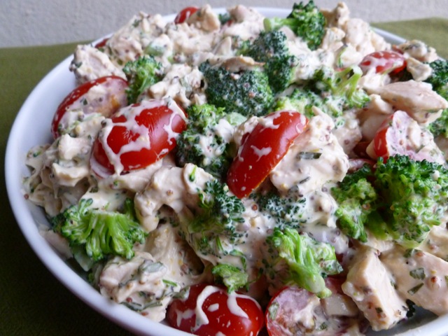 Ina Garten's Mustard Chicken Salad with broccoli and tomatoes in white bowl.