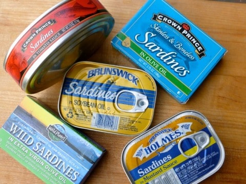 Assortment of canned sardines, in mustard sauce, olive oil and tomato sauce.
