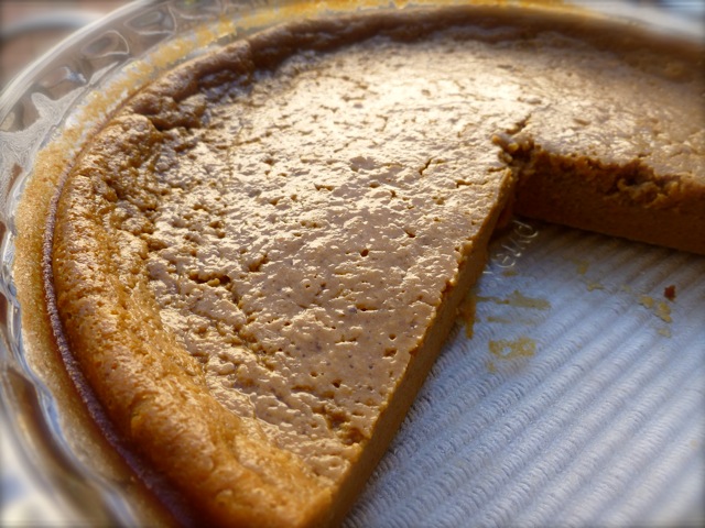 Bisquick impossible pumpkin pie with several pieces missing.