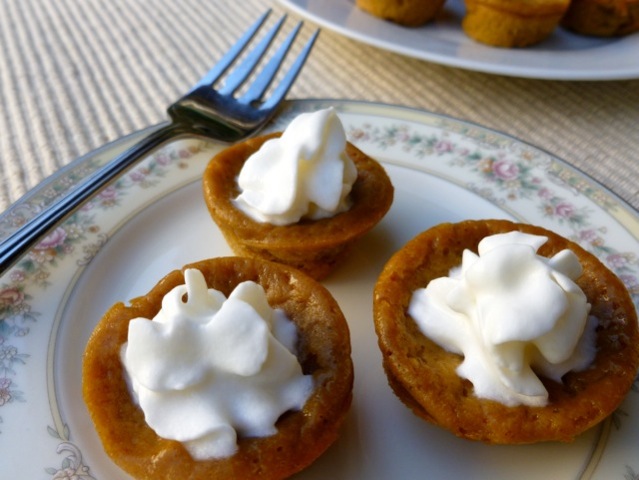3 mini impossible pumpkin pies on china dessert plate with fork alongside