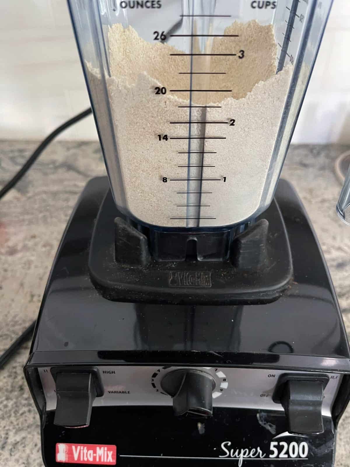 Blending quinoa into flour in Vitamix.