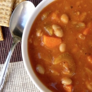 Simple Weight Watchers Cabbage Bean Soup from above with spoon and crackers