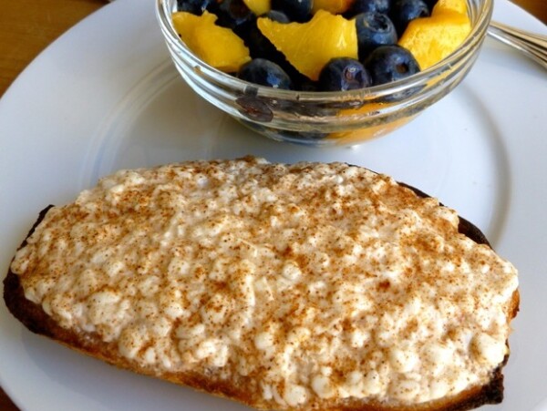 Cottage Cheese on Toast with Cinnamon alongside bowl of blueberries and peaches