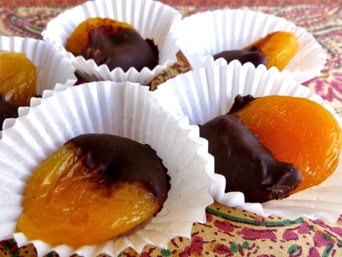 Dark Chocolate Dipped Dried Apricots in paper cupcake holders