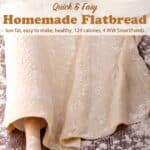 Flatbread dough draped over a rolling pin with flour scatter about.