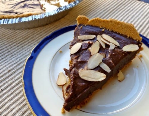 Slice of Homemade Chocolate Tart Topped with Sliced Almonds