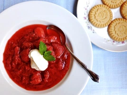 Strawberry Rhubarb Dessert Soup topped with a dollop of Greek yogurt and fresh mint with a plate of shortbread cookies.