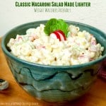 classic macaroni salad in green pottery bowl wood table