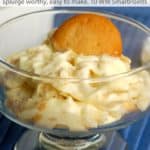 Banana pudding with vanilla wafer cookies in white serving dish