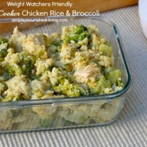 Close Up of Slow Cooker Chicken Broccoli Rice in a clear glass container on beige placemat