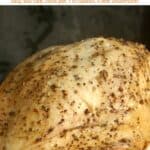 Seasoned slow cooker turkey breast without skin on serving platter.
