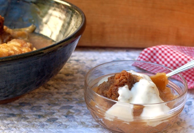 Baked Apples with Gingersnaps in a bowl topped with vanilla ice cream