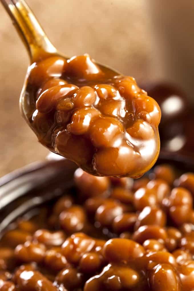 Spoonful of baked beans up close.