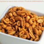3-Ingredient Spicy Peanuts in square white bowl up close.